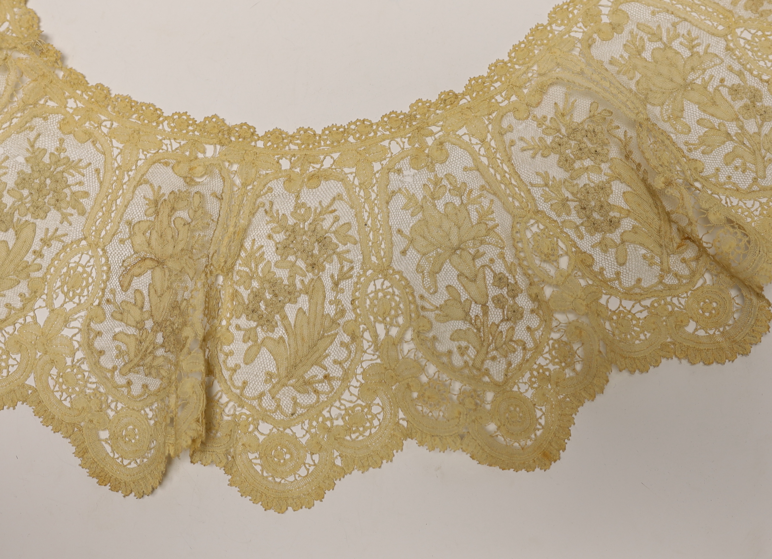 A long 19th century mixed Brussels lace collar, with 20 needle lace oval insertions, a similar wider Honiton bobbin lace collar and a machine lace bonnet veil